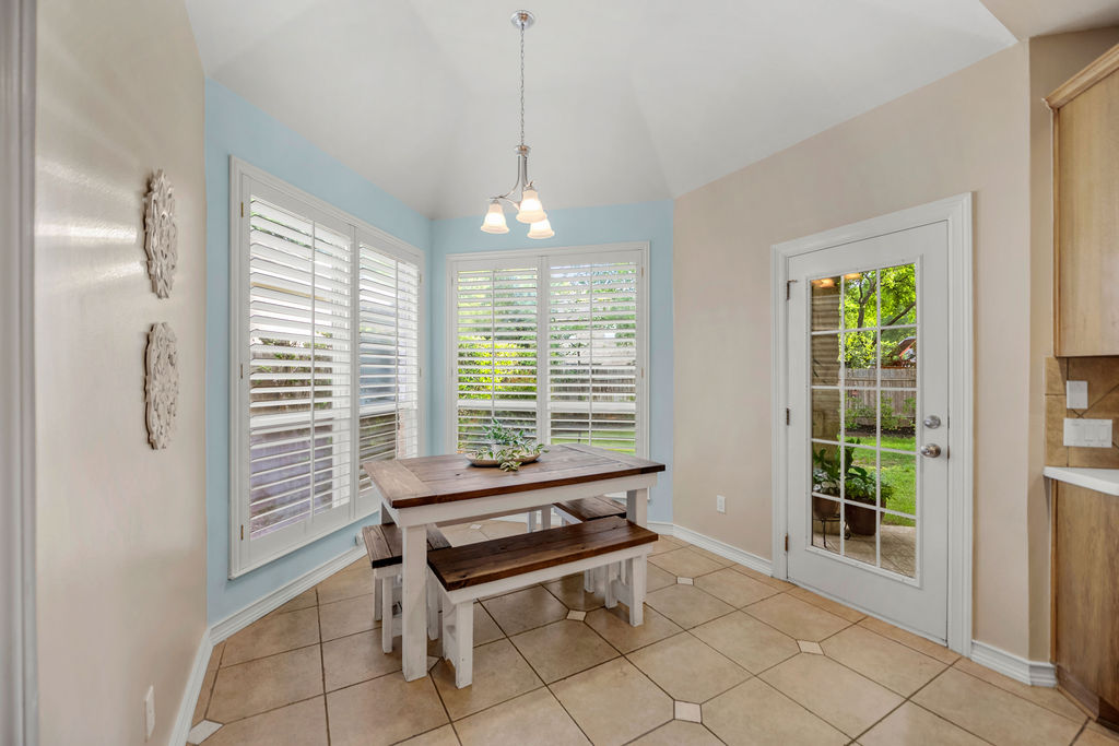4600 Slickrock Cove Austin, TX 78747 - Photo 6 of 40 a dining room with a window and ceiling fan