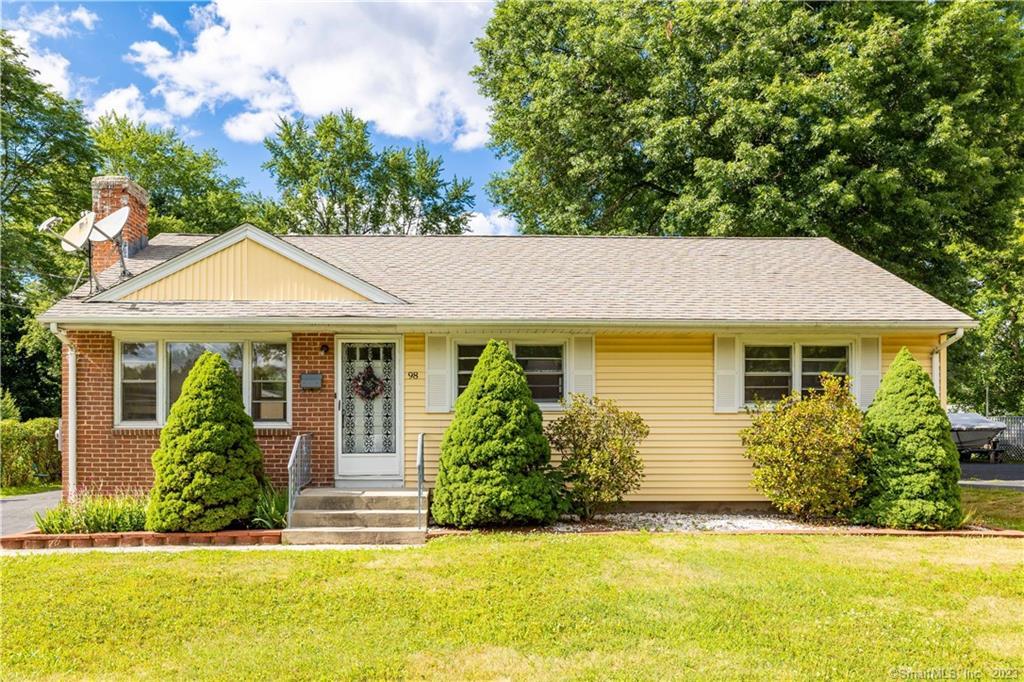 98 East Robbins Avenue Newington, CT 06111 - Photo 1 of 1 a front view of a house with a yard