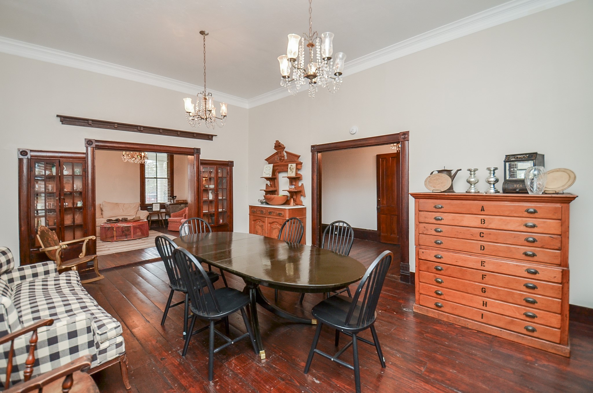 1205 12th Street Hempstead, TX 77445 - Photo 12 of 36 a dining room with furniture a chandelier and wooden floor