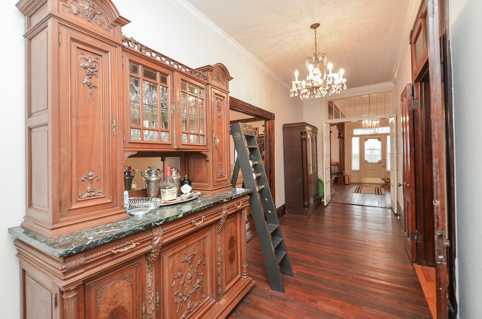 1205 12th Street Hempstead, TX 77445 - Photo 16 of 36 a kitchen with stainless steel appliances granite countertop a refrigerator a sink dishwasher a stove and a dining table with wooden floor