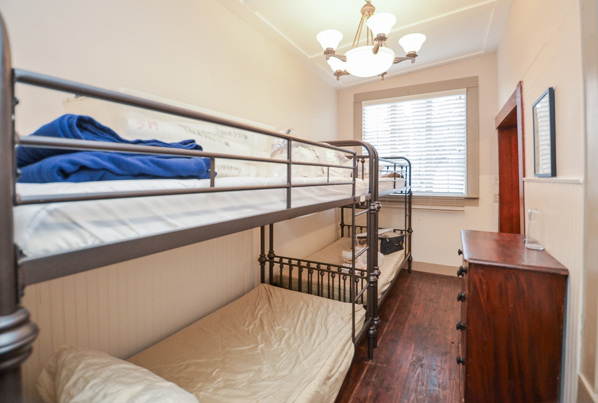1205 12th Street Hempstead, TX 77445 - Photo 26 of 36 a living room with furniture and a chandelier