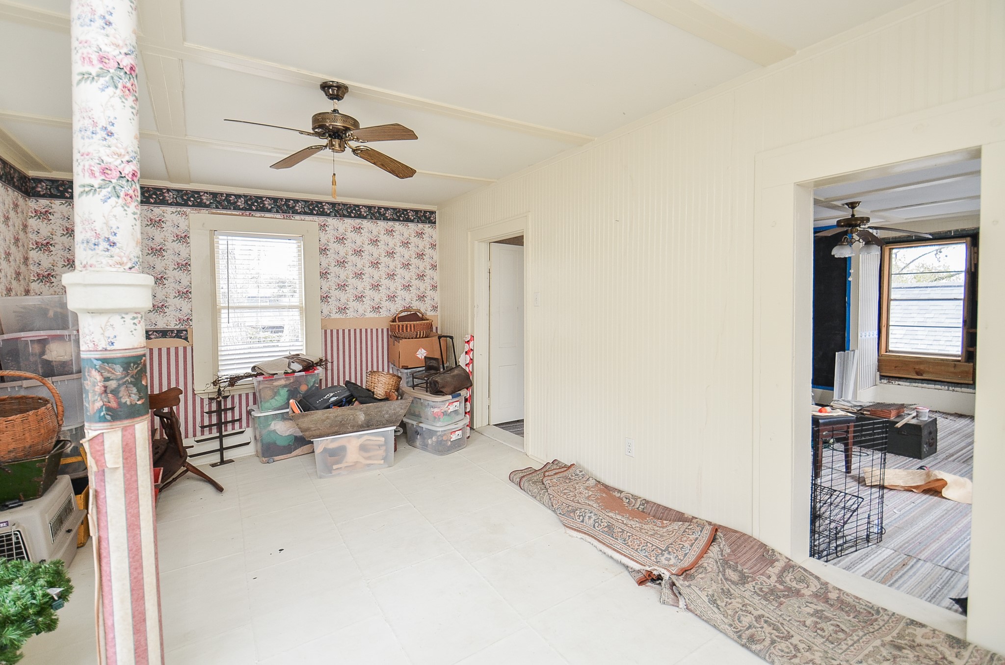 1205 12th Street Hempstead, TX 77445 - Photo 28 of 36 a living room with furniture and a chandelier