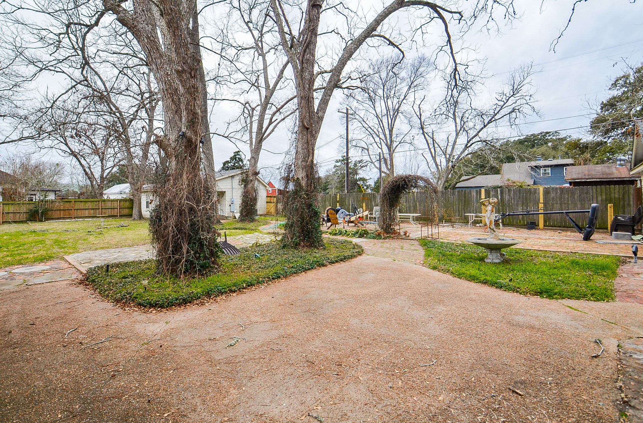 1205 12th Street Hempstead, TX 77445 - Photo 30 of 36 a front view of a house with garden and trees