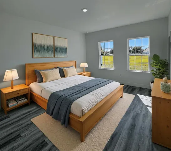 a bedroom with a bed and a flat screen tv