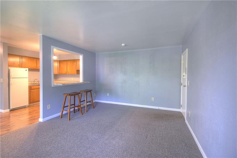 61 Darlington Road, Unit A8 Beaver Falls, PA 15010 - Photo 15 of 21 Living Room/Kitchen/Pass-through bar