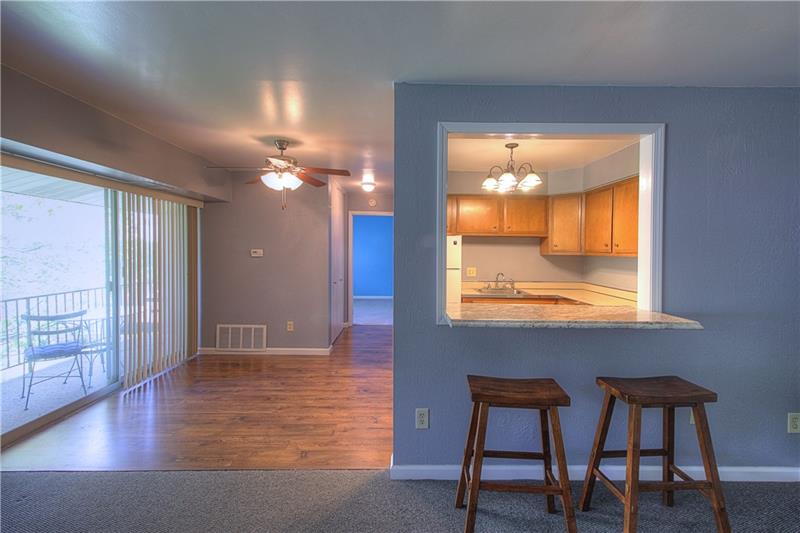 61 Darlington Road, Unit A8 Beaver Falls, PA 15010 - Photo 4 of 21 Dining opens onto balcony ~ Flowing dining/kitchen area
