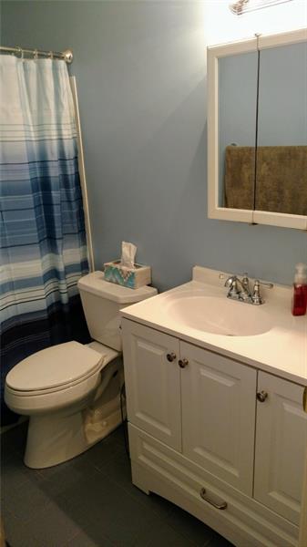 61 Darlington Road, Unit A8 Beaver Falls, PA 15010 - Photo 6 of 21 Updated bathroom featuring white vanity & medicine cabinet and cool tone walls.