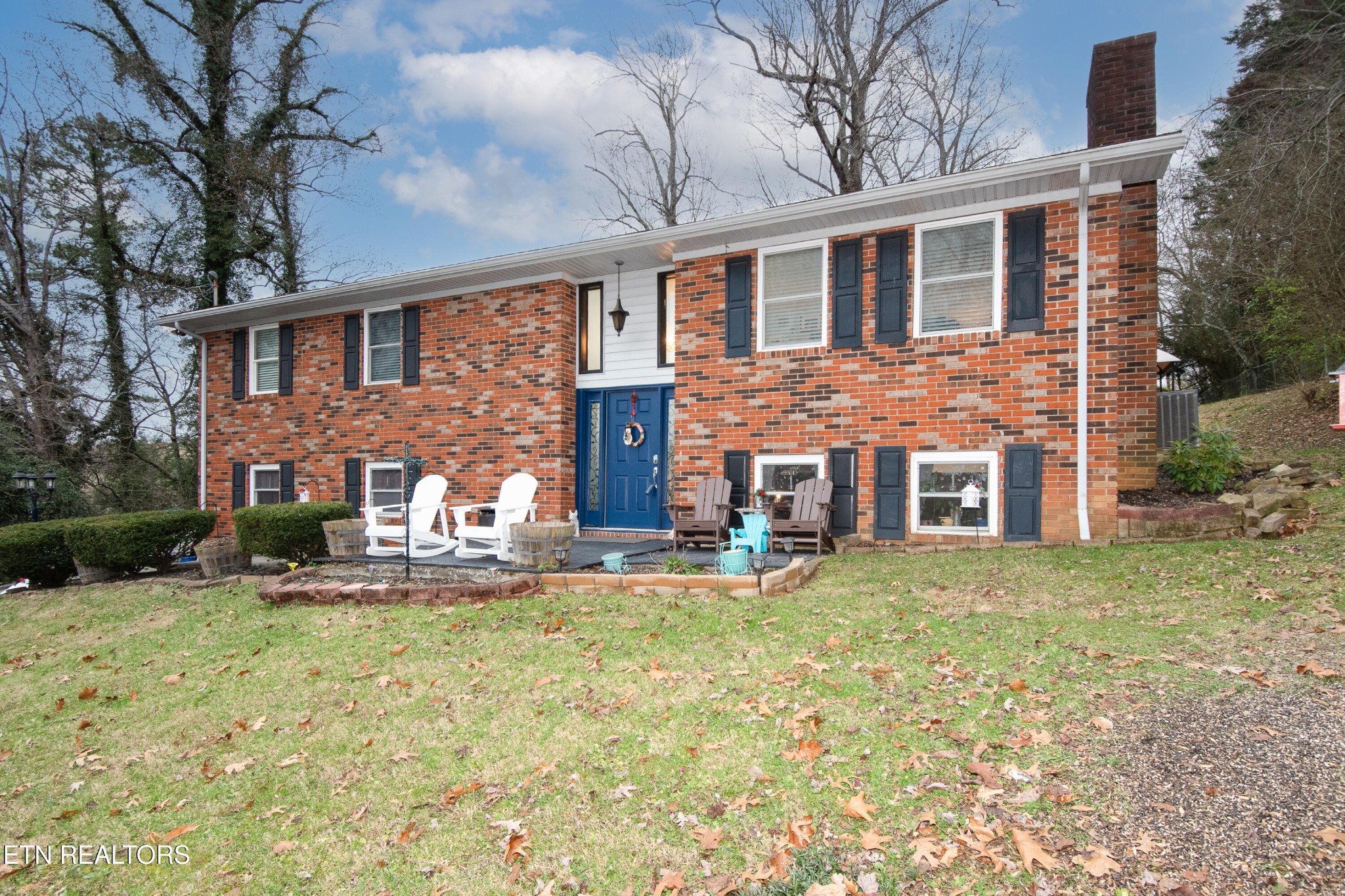 109 Ivy Lane Clinton, TN 37716 - Photo 1 of 36 a front view of a house with patio yard and outdoor seating