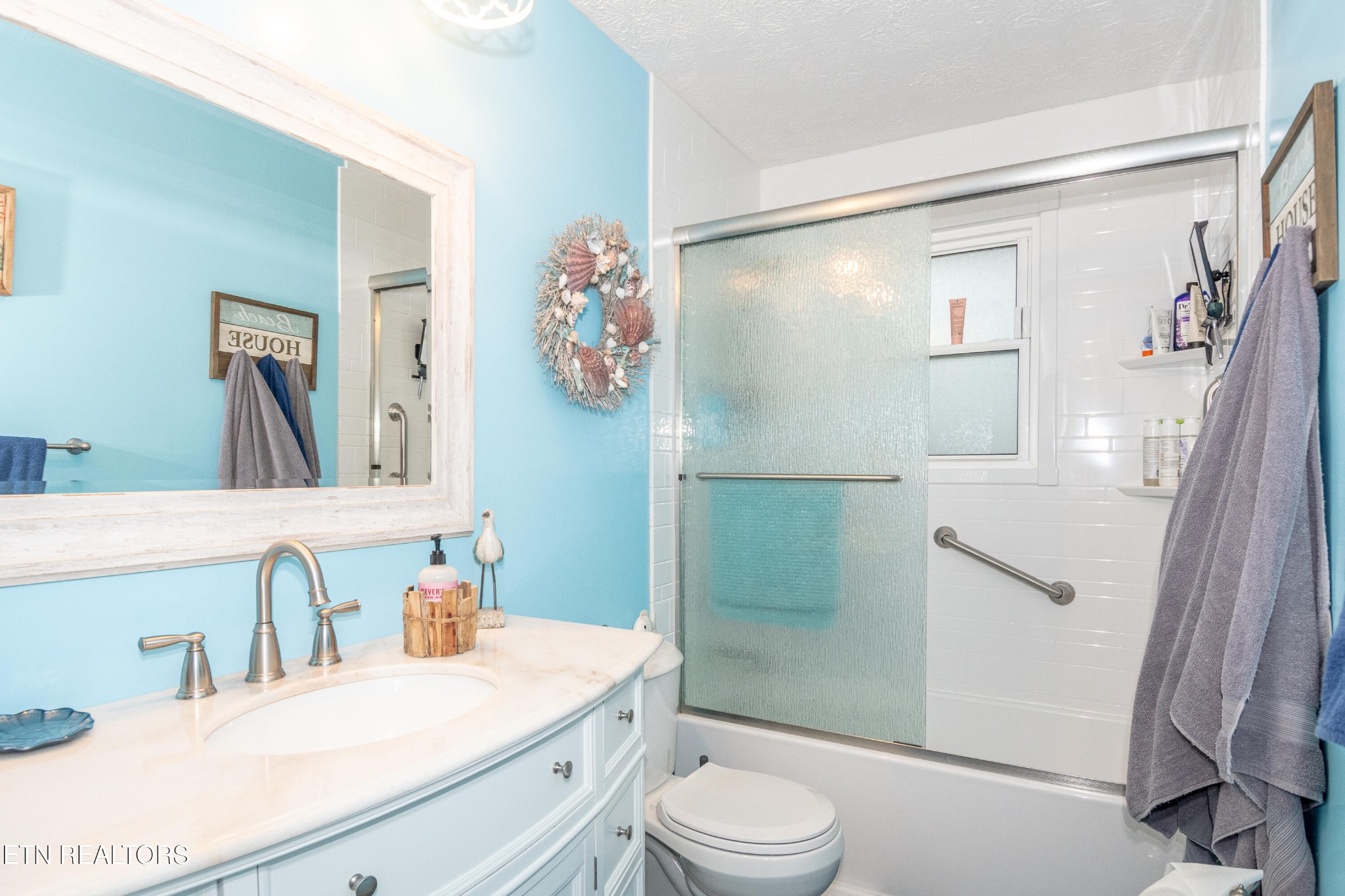 109 Ivy Lane Clinton, TN 37716 - Photo 16 of 36 a bathroom with a sink a toilet and shower