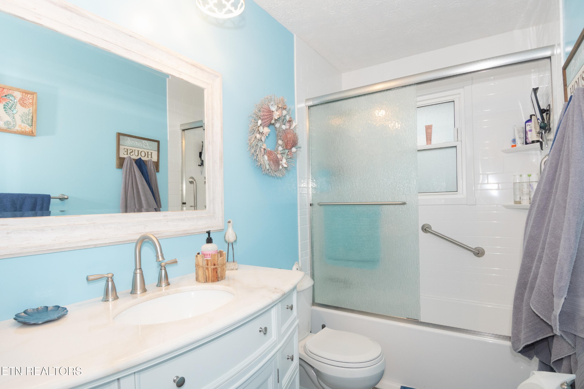 109 Ivy Lane Clinton, TN 37716 - Photo 17 of 36 a bathroom with a sink a toilet and shower