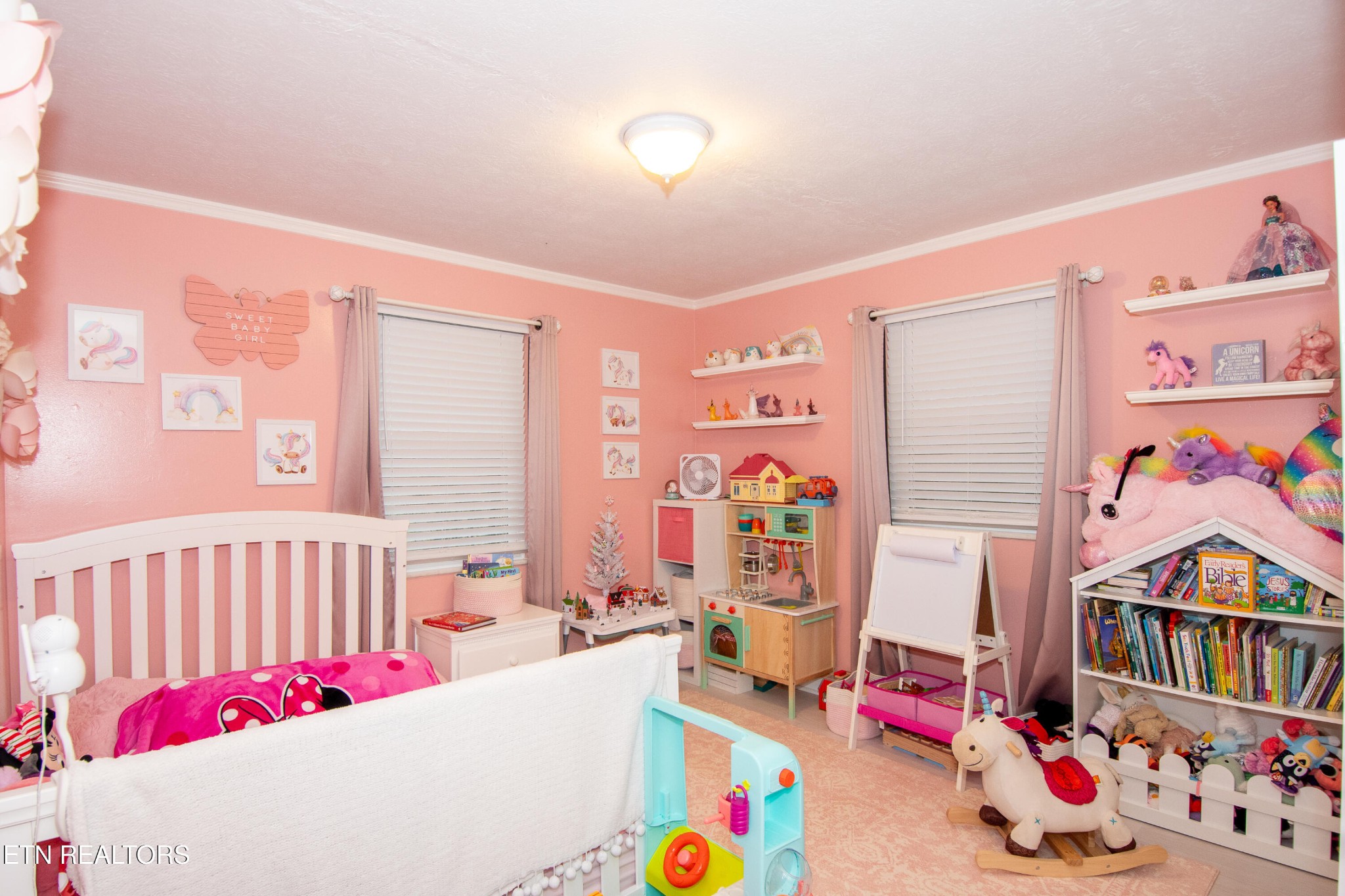 109 Ivy Lane Clinton, TN 37716 - Photo 18 of 36 a bedroom with toys and a baby crib