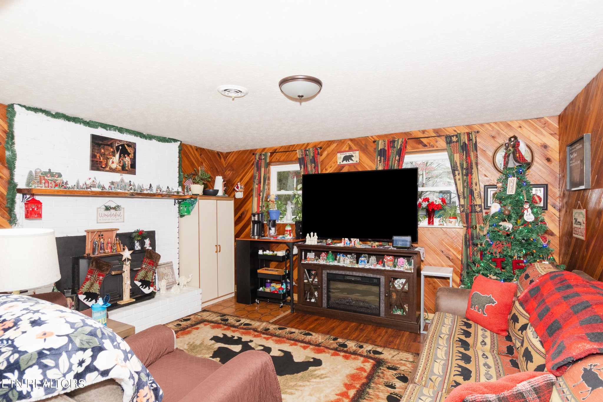 109 Ivy Lane Clinton, TN 37716 - Photo 23 of 36 a bedroom with furniture and a flat screen tv