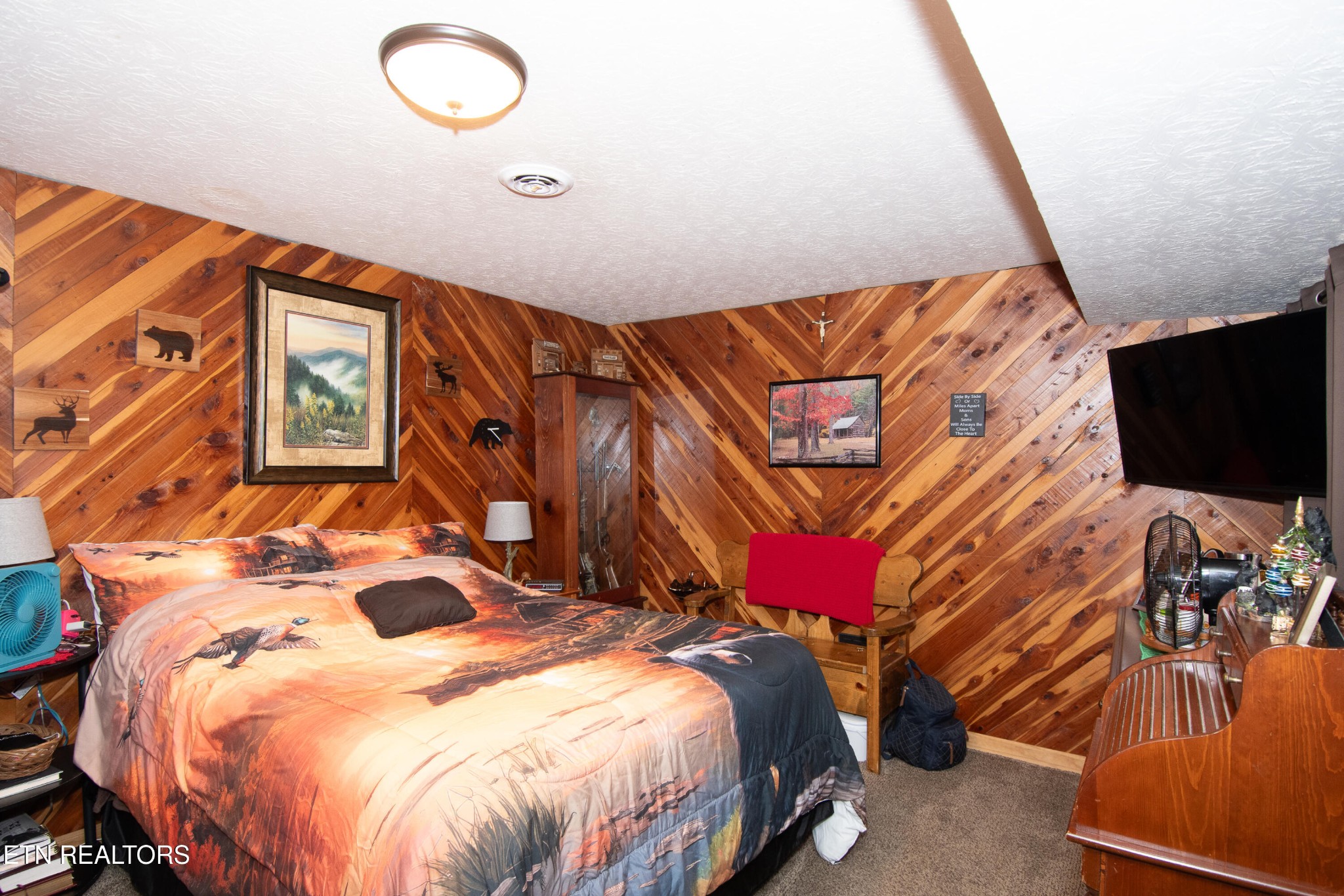 109 Ivy Lane Clinton, TN 37716 - Photo 25 of 36 a bedroom with a bed and a painting on the wall
