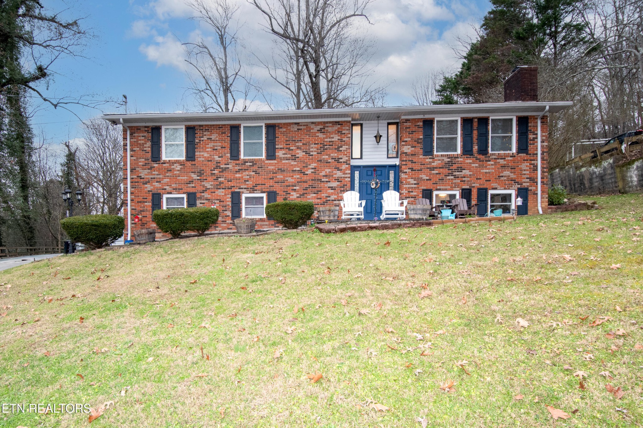 109 Ivy Lane Clinton, TN 37716 - Photo 35 of 36 a view of a house with a yard and plants
