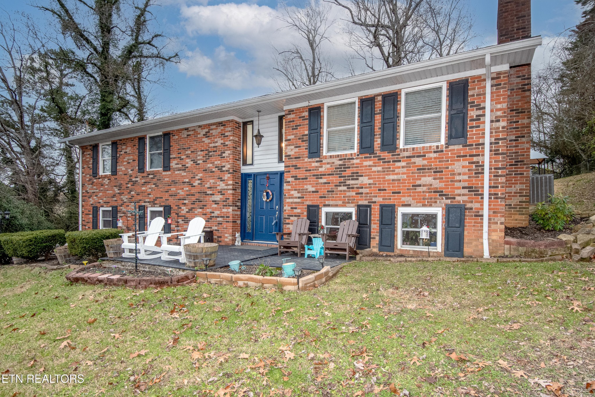 109 Ivy Lane Clinton, TN 37716 - Photo 36 of 36 a brick building with a yard in front of it