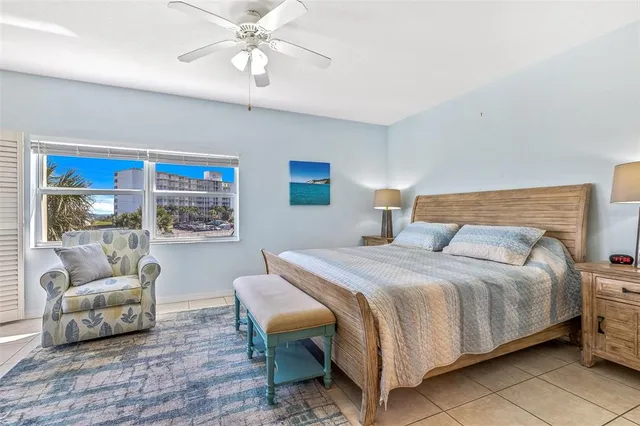 a bedroom with bed and a couch