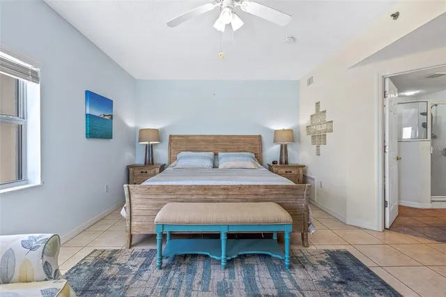 a bedroom with a bed and a table