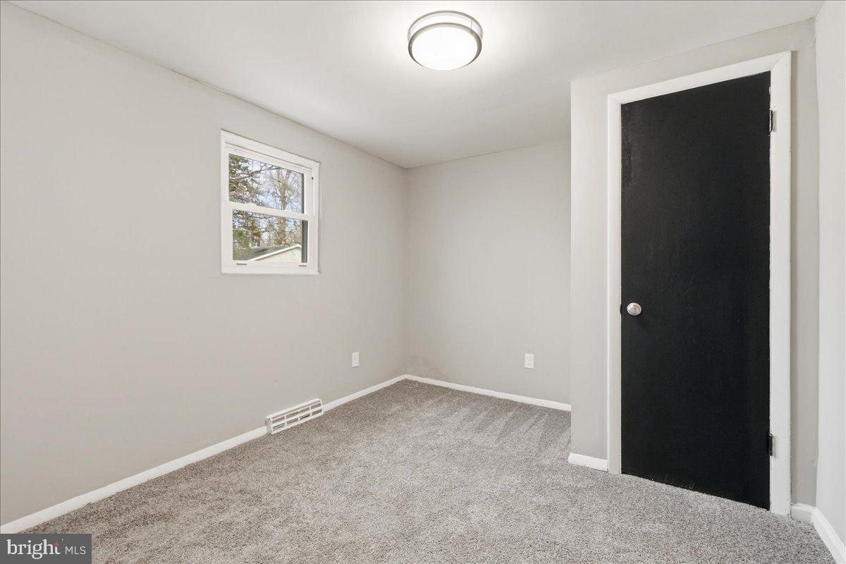 8710 Sum Place Charlotte Hall, MD 20622 - Photo 16 of 30 an empty room with windows