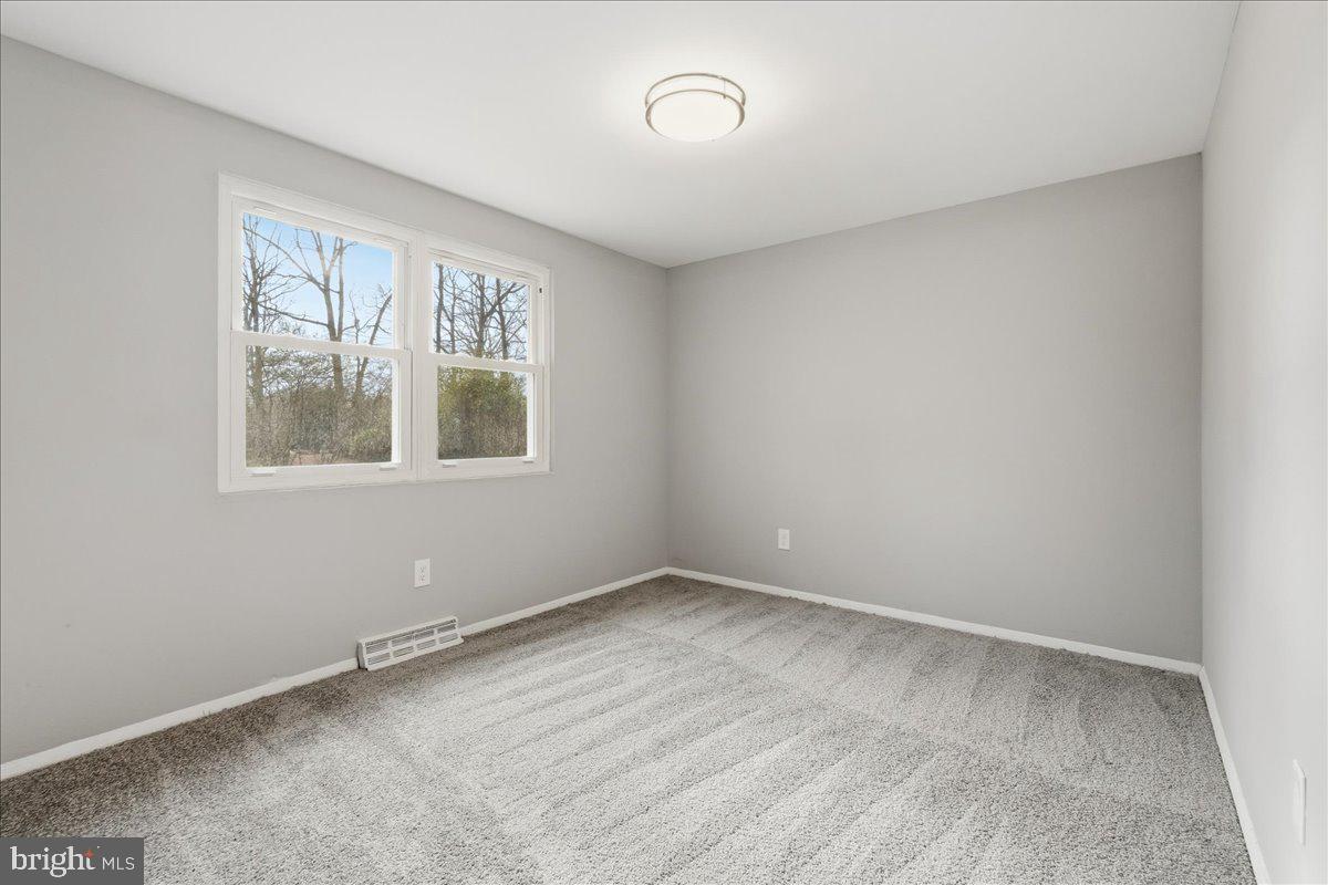 8710 Sum Place Charlotte Hall, MD 20622 - Photo 19 of 30 an empty room with a window