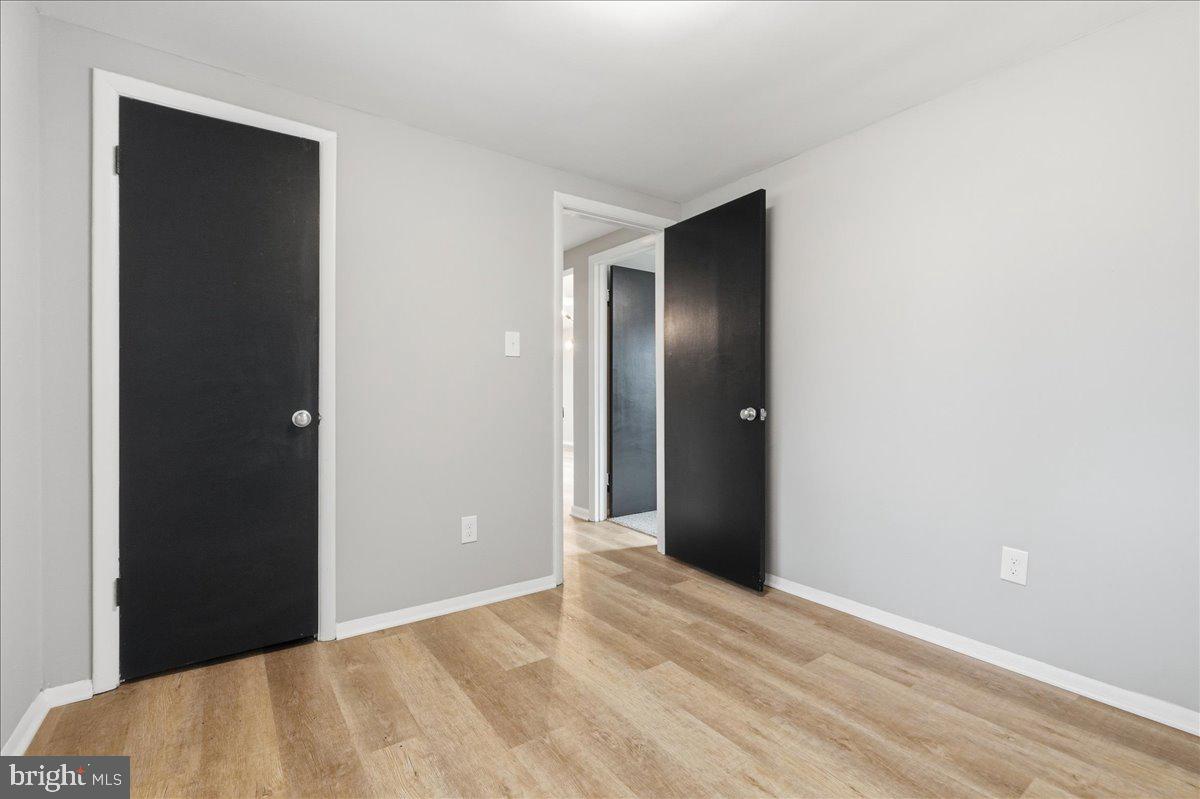 8710 Sum Place Charlotte Hall, MD 20622 - Photo 21 of 30 a view of an empty room with closet and wooden floor