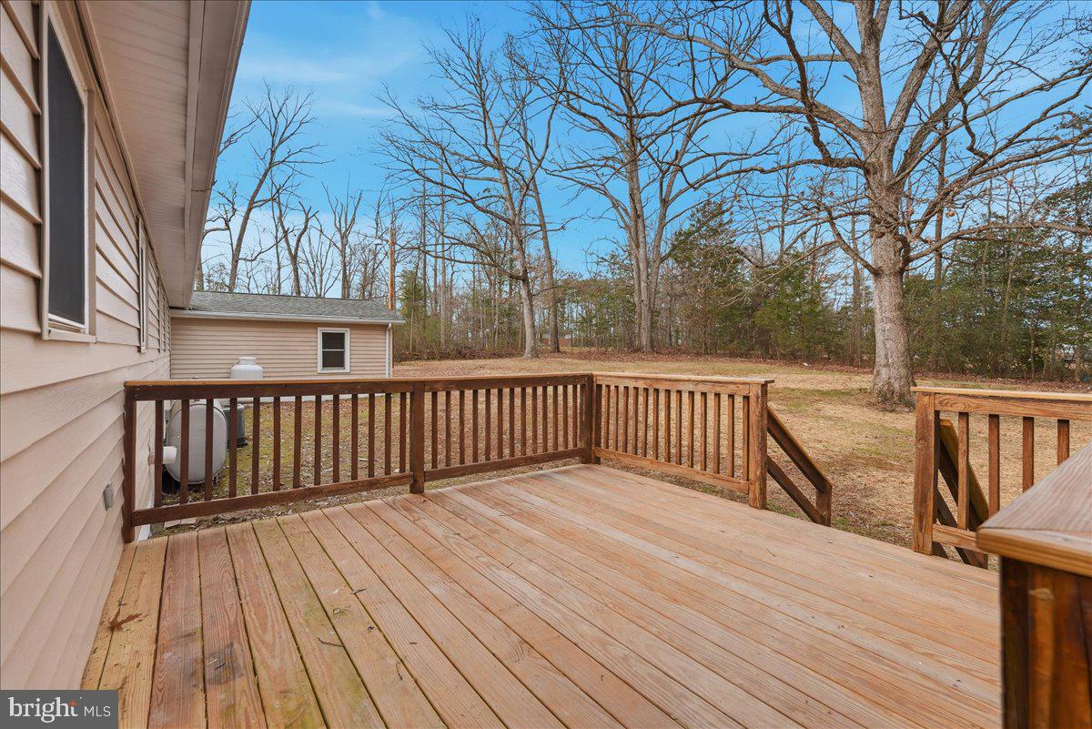 8710 Sum Place Charlotte Hall, MD 20622 - Photo 23 of 30 a view of balcony with wooden floor and fence