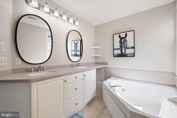 a white toilet sitting next to a bath tub