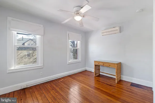 a bed room with a bed and a chair