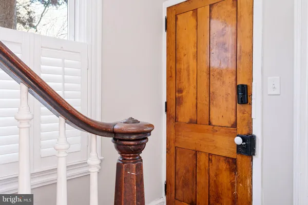 a view of an entryway with wooden floor