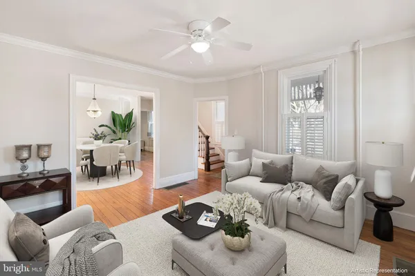 a view of livingroom with hardwood floor and a ceiling fan