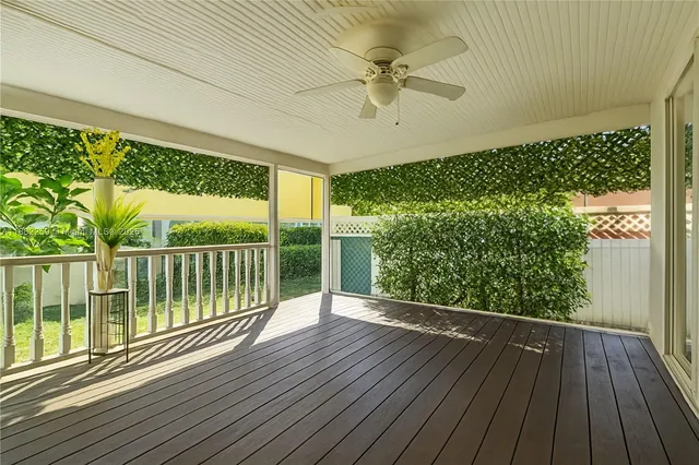 a view of a balcony with wooden floor
