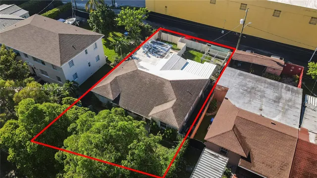 an aerial view of houses with an outdoor space