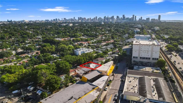 a view of a backyard with wooden fence