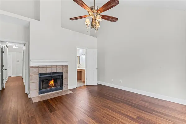 a view of a livingroom with a fireplace and wooden floor