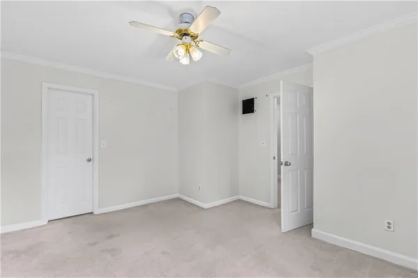 a view of an empty room and a window