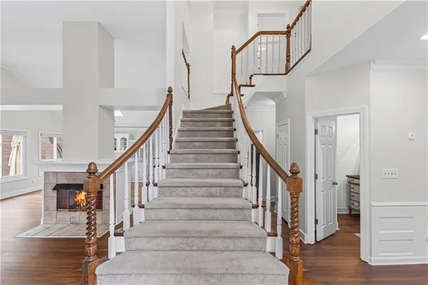 a view of entryway and hall with wooden floor