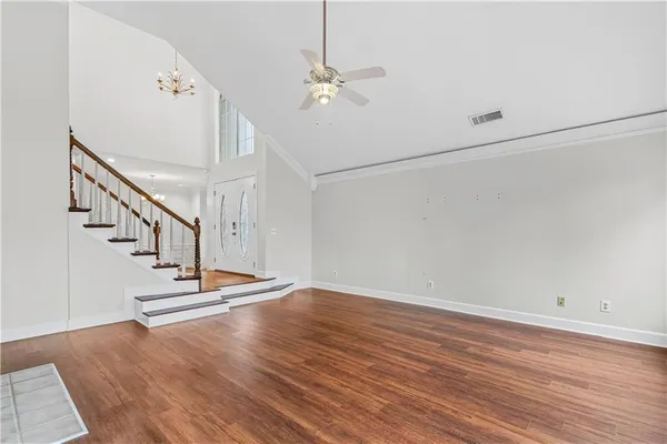 a view of entryway and hall with wooden floor