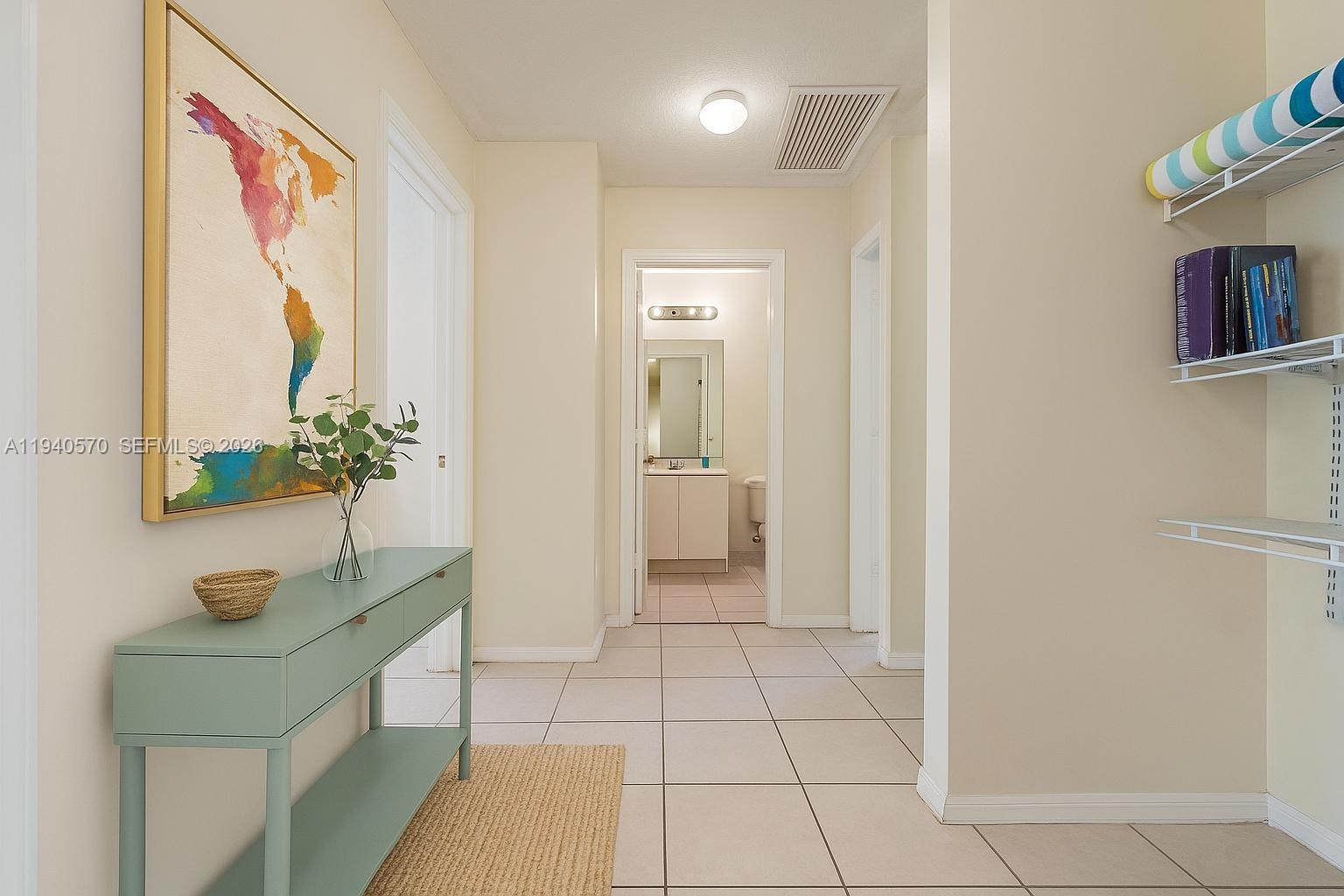 14116 Southwest 260th Street, Unit 105 Homestead, FL 33032 - Photo 14 of 30 a spacious bathroom with a sink a mirror and a shower