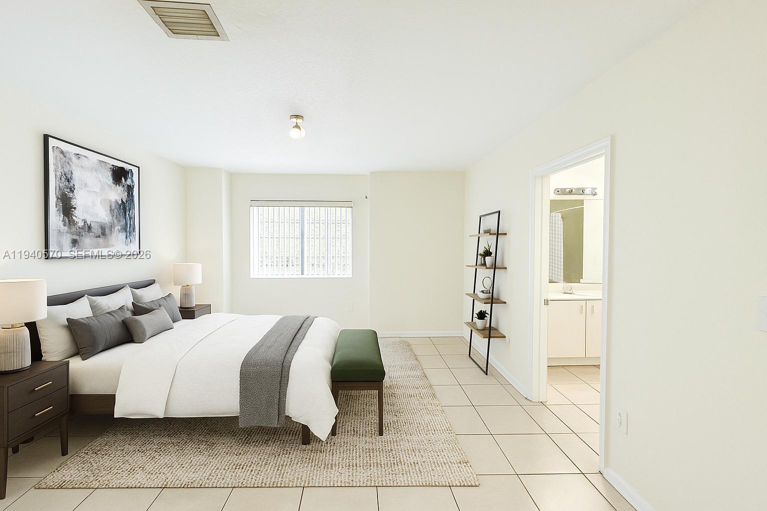 14116 Southwest 260th Street, Unit 105 Homestead, FL 33032 - Photo 15 of 30 a spacious bedroom with a bed and a window