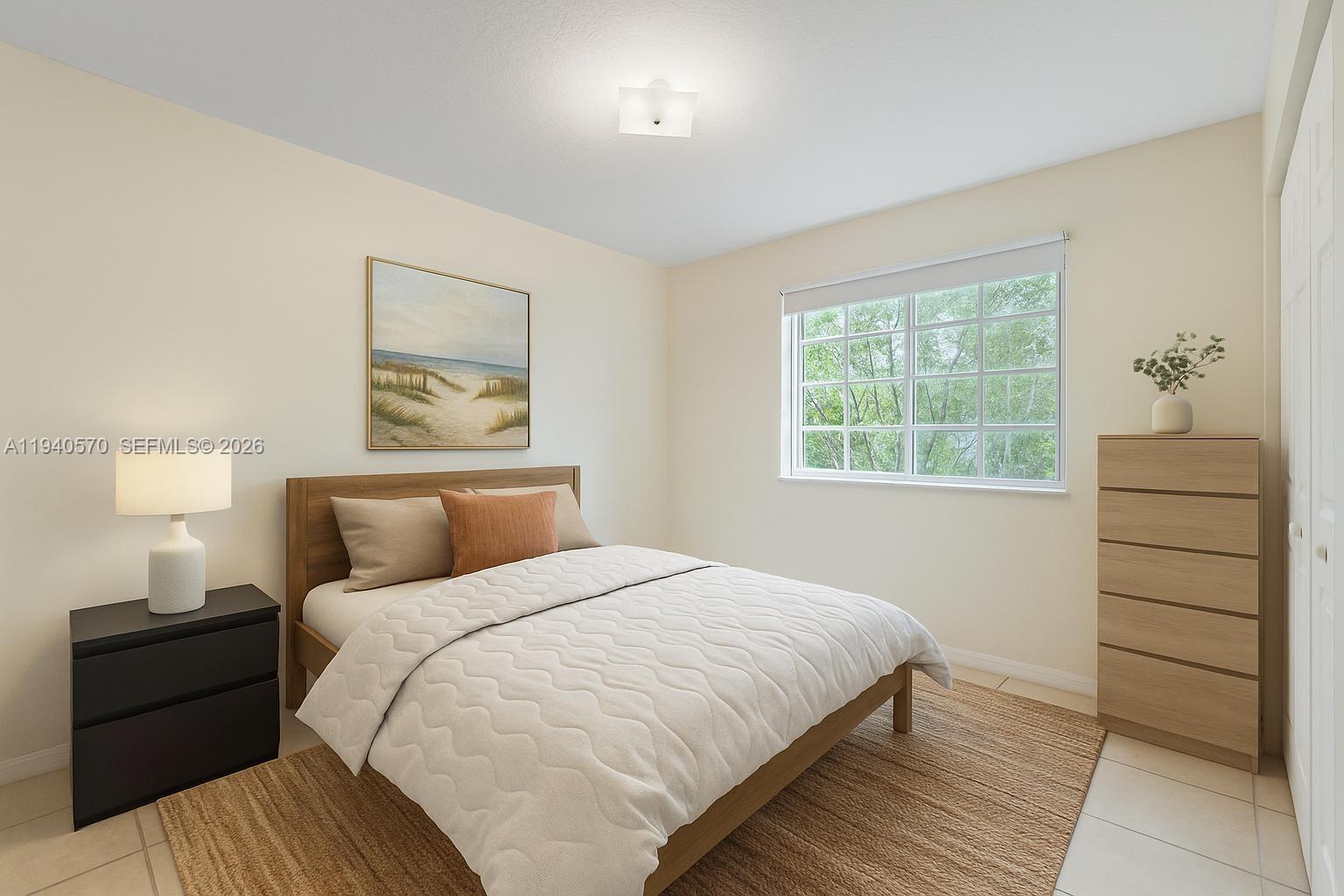 14116 Southwest 260th Street, Unit 105 Homestead, FL 33032 - Photo 18 of 30 a bedroom with a bed and a window