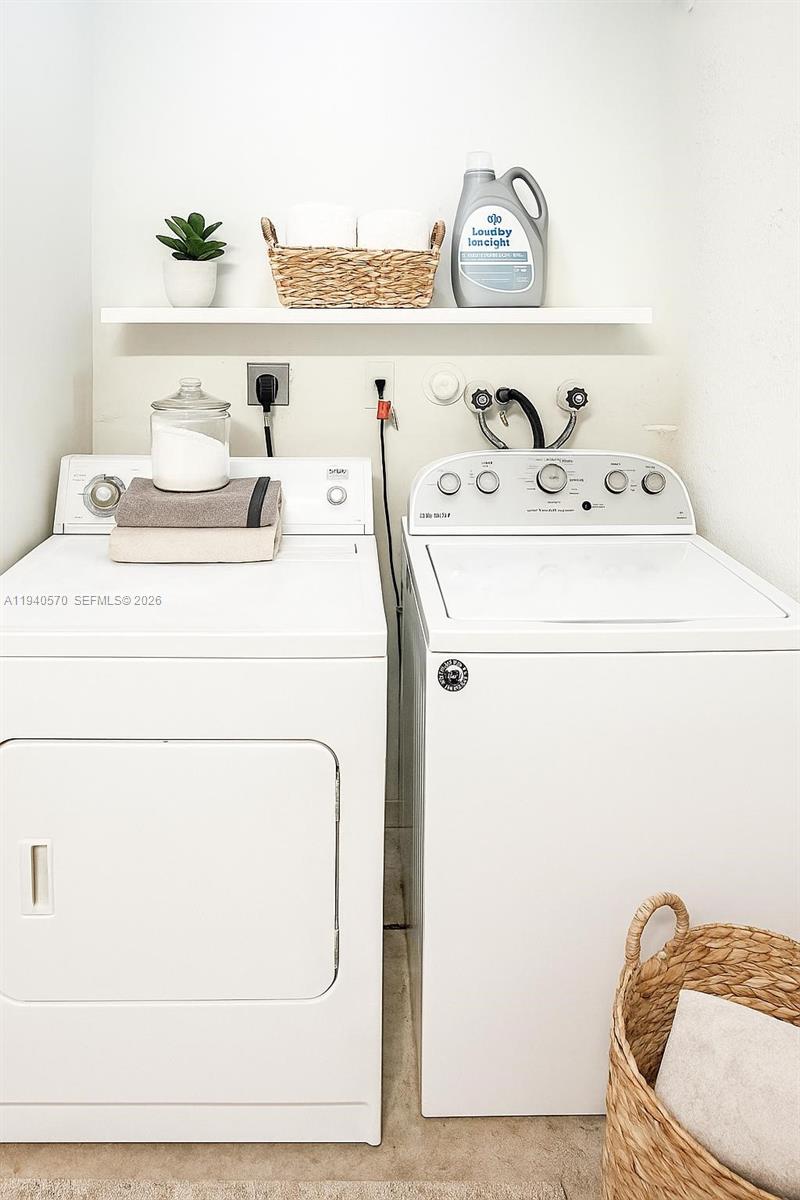 14116 Southwest 260th Street, Unit 105 Homestead, FL 33032 - Photo 23 of 30 a utility room with washer and dryer