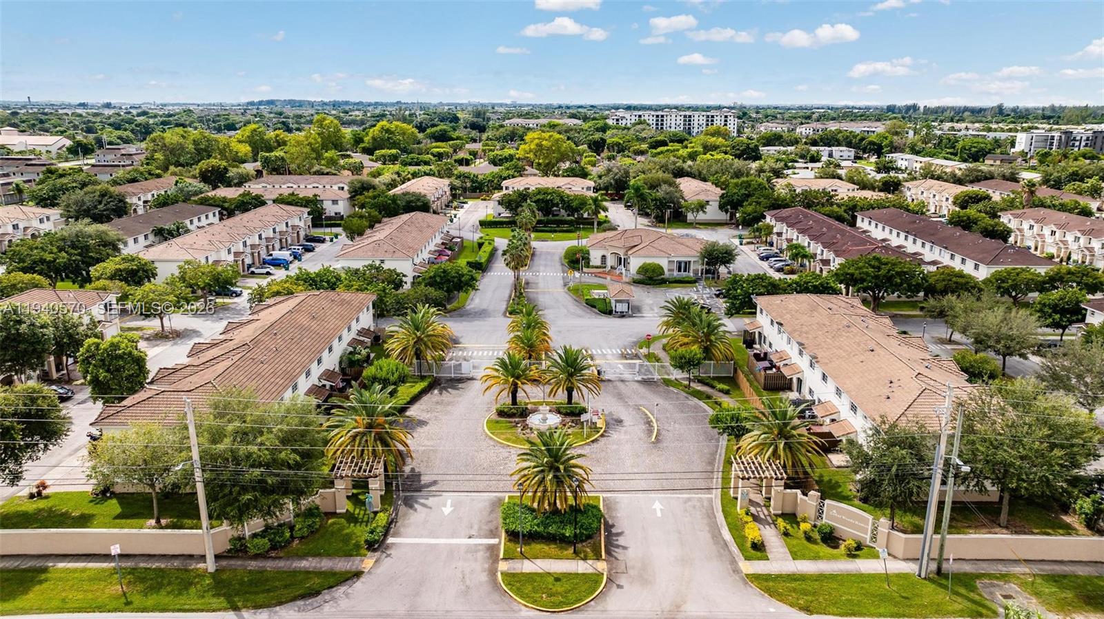 14116 Southwest 260th Street, Unit 105 Homestead, FL 33032 - Photo 29 of 30 an aerial view of residential houses with outdoor space and swimming pool