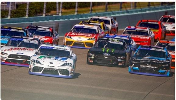 14116 Southwest 260th Street, Unit 105 Homestead, FL 33032 - Photo 3 of 30 a view of a cars park in front of retail shop