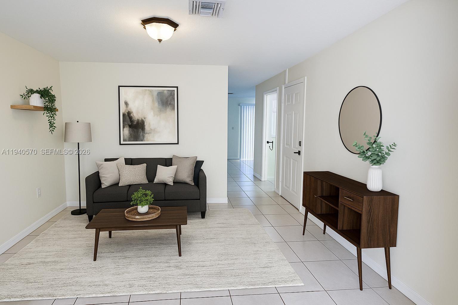 14116 Southwest 260th Street, Unit 105 Homestead, FL 33032 - Photo 7 of 30 a living room with furniture
