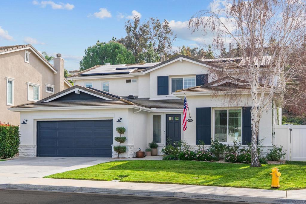 31401 Chemin Chevalier Temecula, CA 92591 - Photo 1 of 74 a front view of a house with a yard and garage