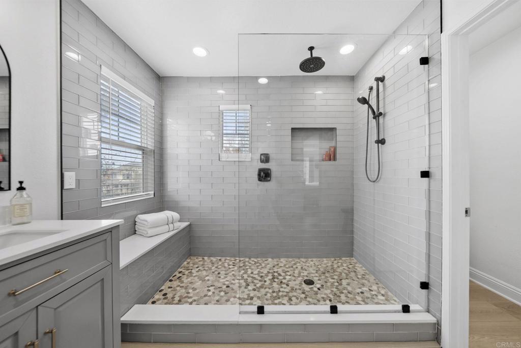 31401 Chemin Chevalier Temecula, CA 92591 - Photo 20 of 74 a bathroom with a tub a sink and a large mirror