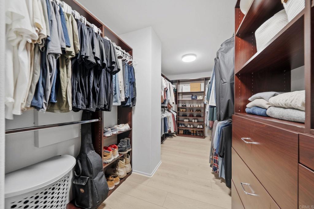 31401 Chemin Chevalier Temecula, CA 92591 - Photo 22 of 74 a view of walk in closet with clothes and shoes