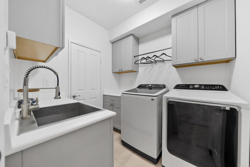 31401 Chemin Chevalier Temecula, CA 92591 - Photo 46 of 74 a kitchen with a refrigerator and a sink