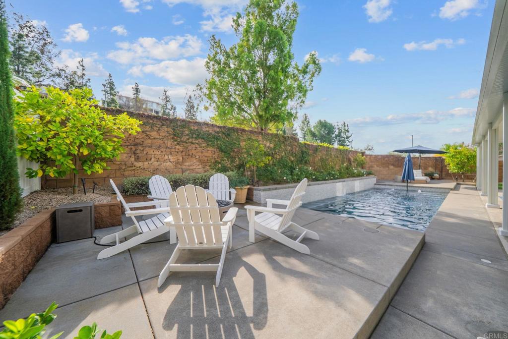 31401 Chemin Chevalier Temecula, CA 92591 - Photo 10 of 74 a view of a patio with table and chairs and potted plants