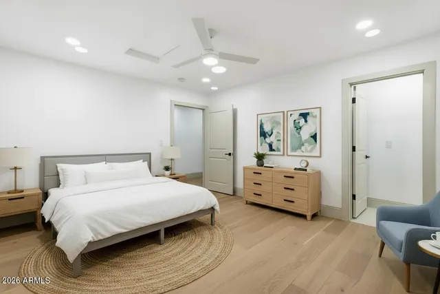 a bedroom with a large bed and a window