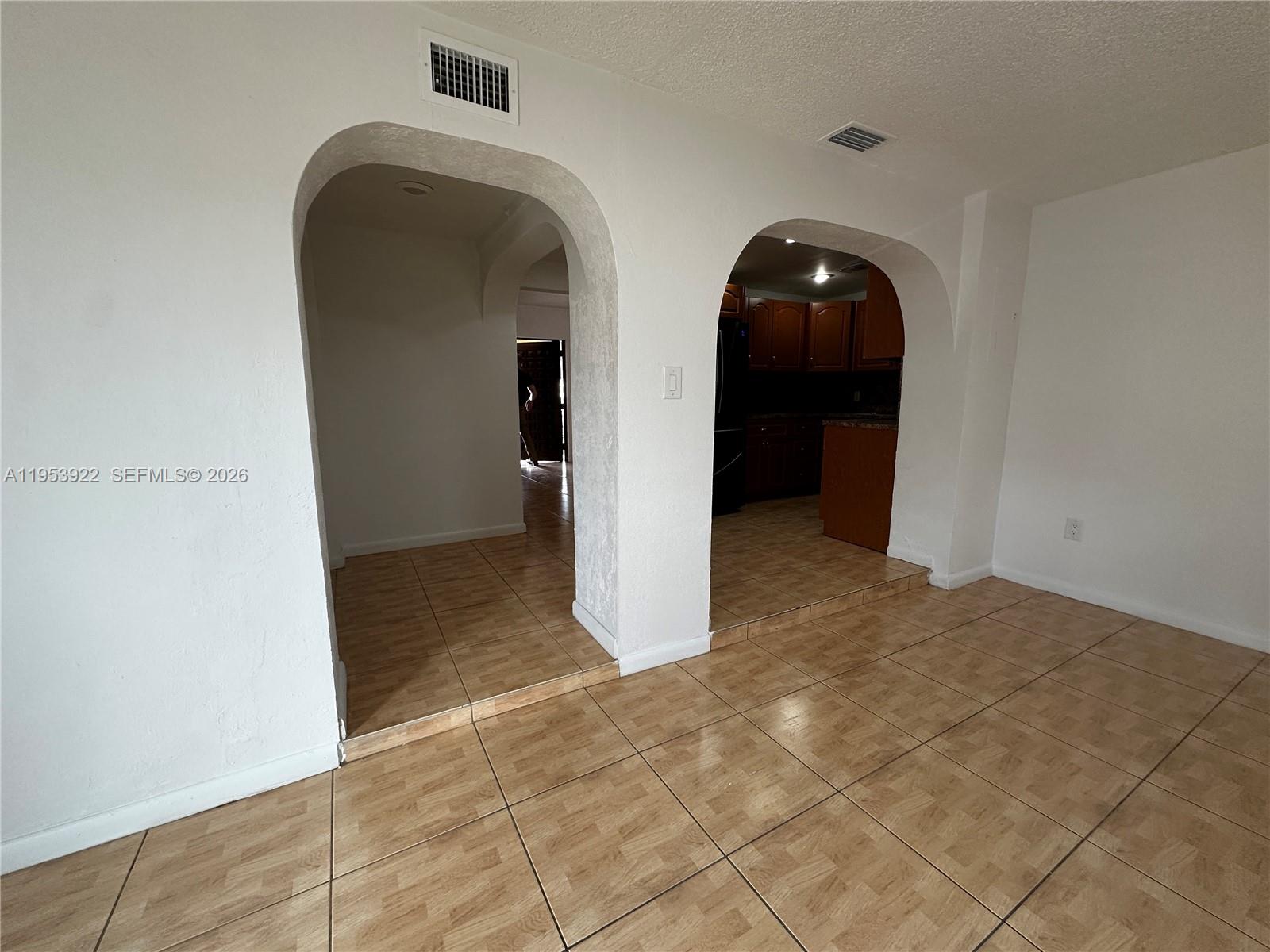 350 West 34th Street Hialeah, FL 33012 - Photo 8 of 22 a view of a hallway with wooden cabinets